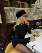 Black Form-Fitting Stretch Mini Dress with Fluted Cuffs – Chic Wedding Guest Cocktail Outfit